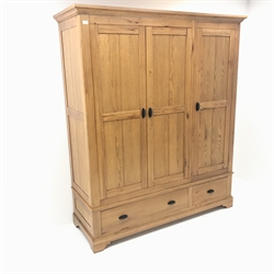 Light oak triple wardrobe, projecting cornice, three doors enclosing hanging rail and shelves above two drawers,  shaped bracket supports, W165cm, H196cm, D59cm