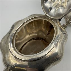 Five piece Edwardian silver tea service, comprising teapot and coffee pot, each with ebonised scroll handle, tea caddy with hinged cover, twin handled open sucrier, and milk jug, each of rounded bombe form, upon four paw feet, hallmarked William Adams Ltd, Birmingham 1904 and 1905, coffee pot H26cm
