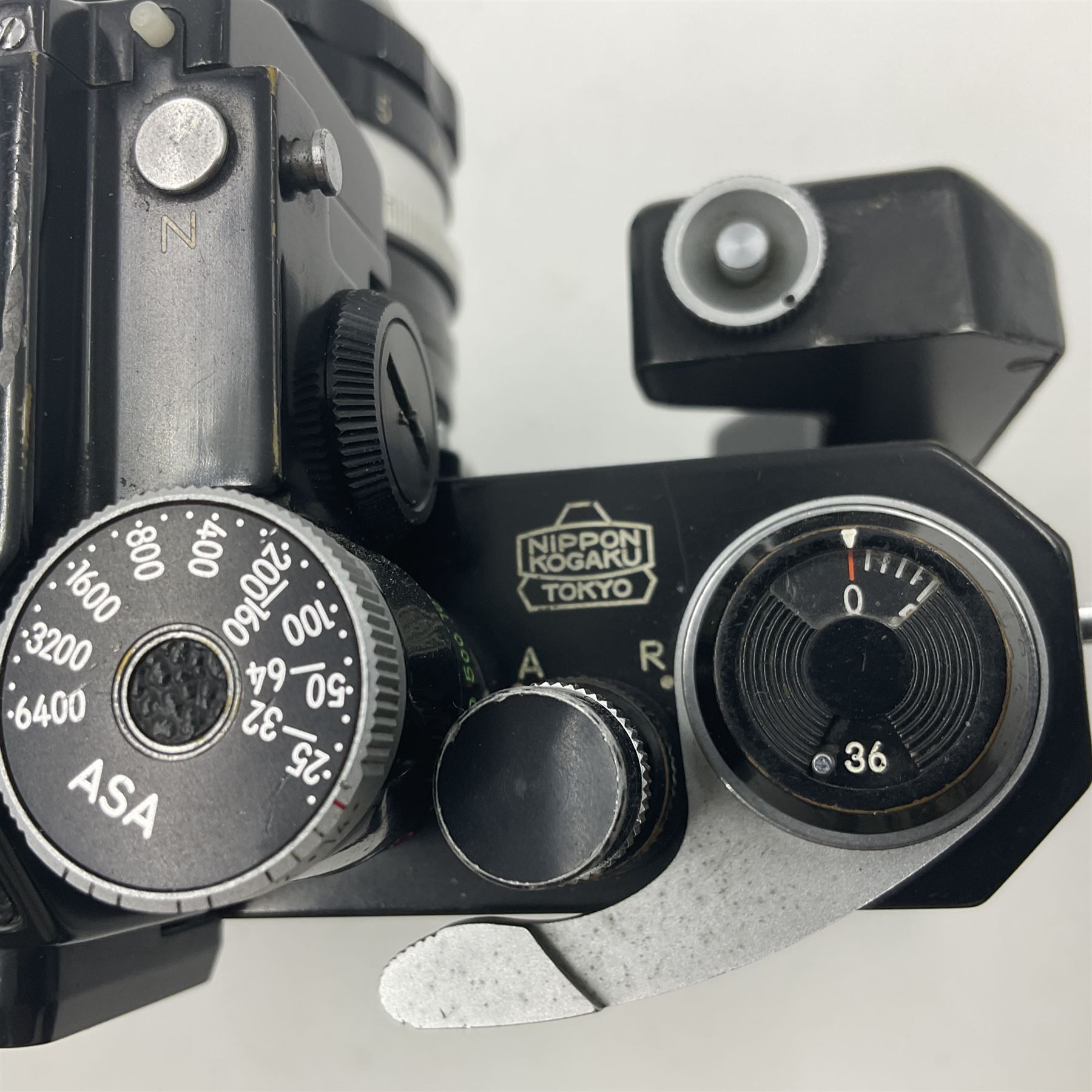 Nikon Photomic TN NKJ camera body, serial no 6728309, circa 1965, with 'Nippon Kogaku NIKKOR-S Auto 1:1.4 f=5.8cm' lens, serial no. 173909, Nikon F36 Motor Drive, serial no.132430 and Nikon cordless battery pack