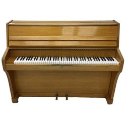 Kemble - English 20th century compact upright piano in light oak case, with an overstrung cast iron frame, underdamper action, original stringing and hammers, with sostenuto and sustain pedals. 88 note compass (7 octaves). 