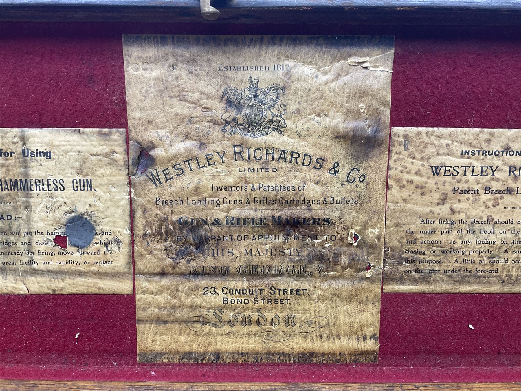 Leather shotgun case, the red baize lined interior with the trade labels of Westley Richards & Co., London, a brass plaque inscribed 'T Nevin, Mirfield, Yorkshire' to cover, with key, case to fit barrel 76cm (30 inches)  
