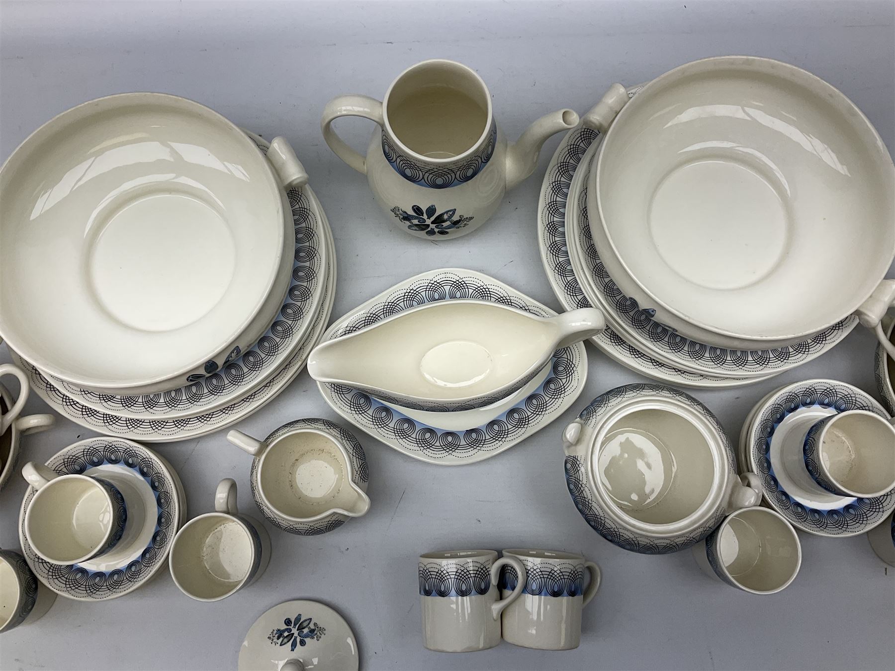 Wedgwood Persephone pattern part tea and dinner service, designed by Eric Ravilious, eight dinner plates, eight side plates, eight dessert plates, two covered tureens, meat platter, coffee pot, eight coffee cans and saucers, milk jug, covered sucrier etc (64)