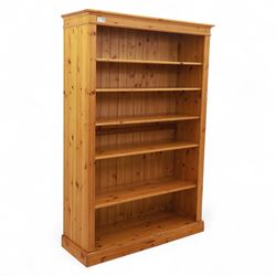Contemporary pine open bookcase, the rectangular form with fluted uprights, tongue and gro...