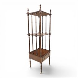 Late Victorian mahogany whatnot, the three tiers supported by turned spindle uprights with turned finials, fitted with a single frieze drawer, raised on turned supports with brass castors