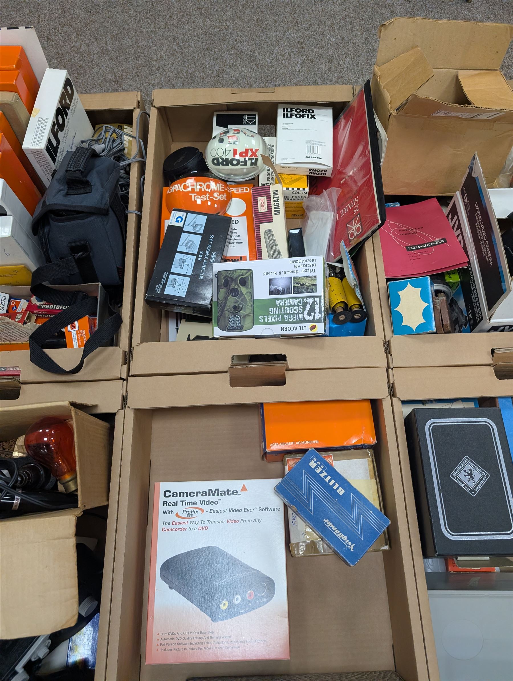 Large collection of photography equipment, including two video cameras JVC and a Panasonic 3CCD, tripods, filters, photograph paper, developing equipment, Dalite projector screen, etc, some boxed some empty boxes, and a Midgard Pocket Microscope