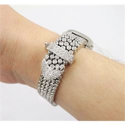 14ct white round brilliant cut diamond belt bracelet, the bracelet with rubover set diamonds, the buckle and clasp with pave set diamonds, stamped 14K, total diamond weight 5.35 carat