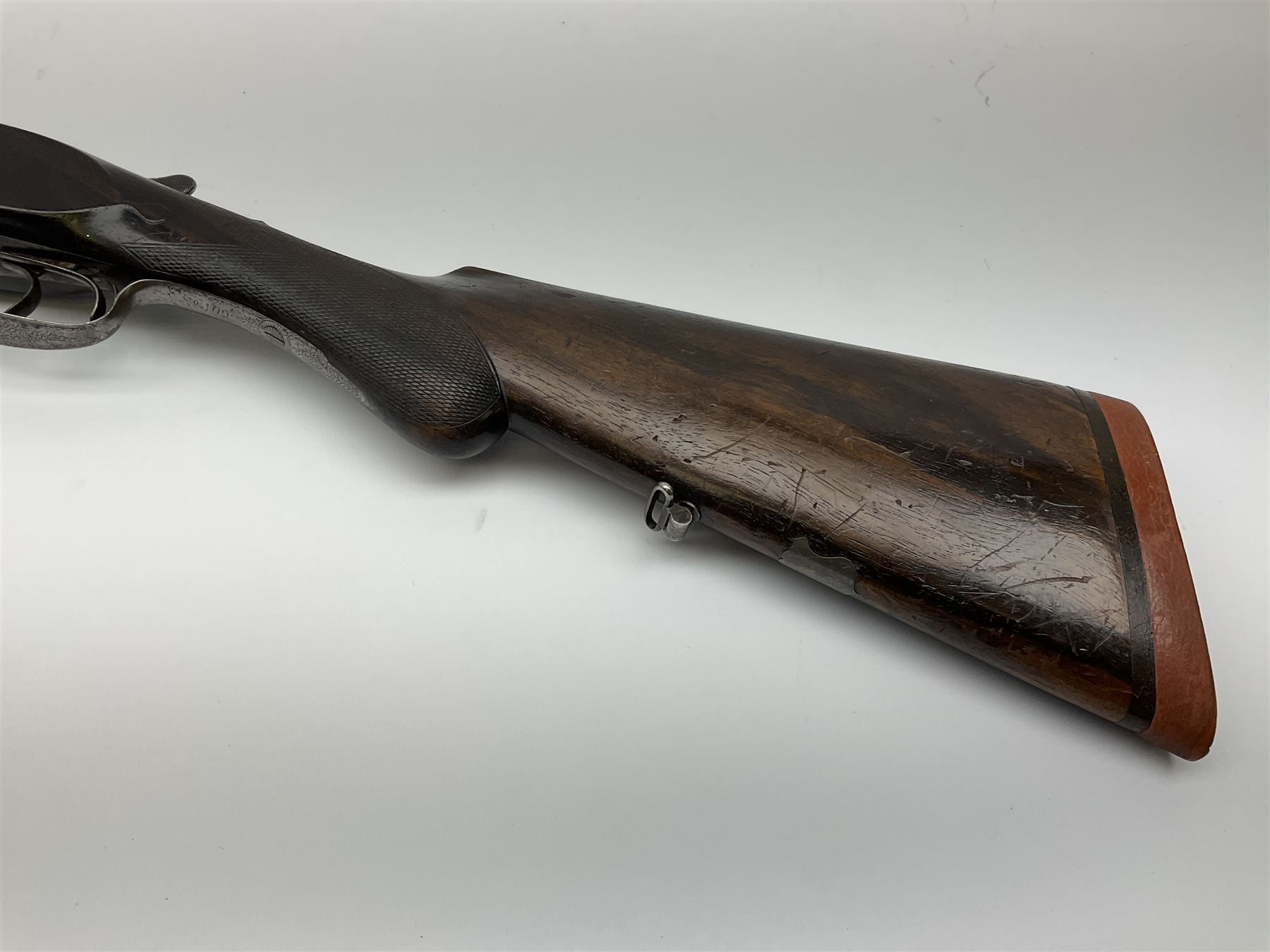 Lincoln Jeffries 12-bore side-by-side double barrel lightweight boxlock non-ejector sporting gun,  out-of-proof 66cm damascus barrels with sunken ribs, profusely engraved action, Prince of Wales walnut stock with chequered pistol grip and fore-end and thumb safety, sling swivels under barrel and stock, serial no.2139(?), L107.5cm overall RFD ONLY