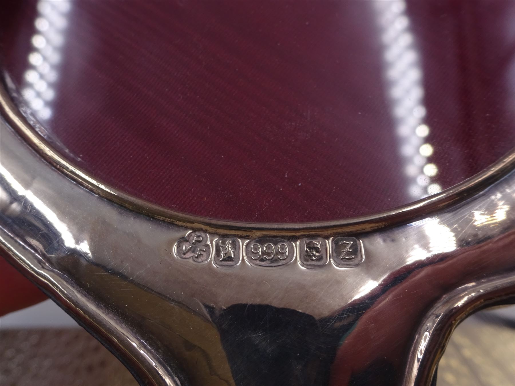 Six modern silver mounted photograph frames, to include an oval example, decorated with doves and green man masks, hallmarked W I Broadway & Co, Birmingham 1985, and a rectangular example with crossed golf club decoration, hallmarked Carr's of Sheffield Ltd, Sheffield 1994 etc, largest H24cm