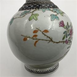 Pair of Chinese Republic porcelain vases, each painted in Famille Rose enamels with pairs of pigeons amidst peony, rock, flowering plants and leafy branches, possibly Qianlong seal beneath, H22cm 
