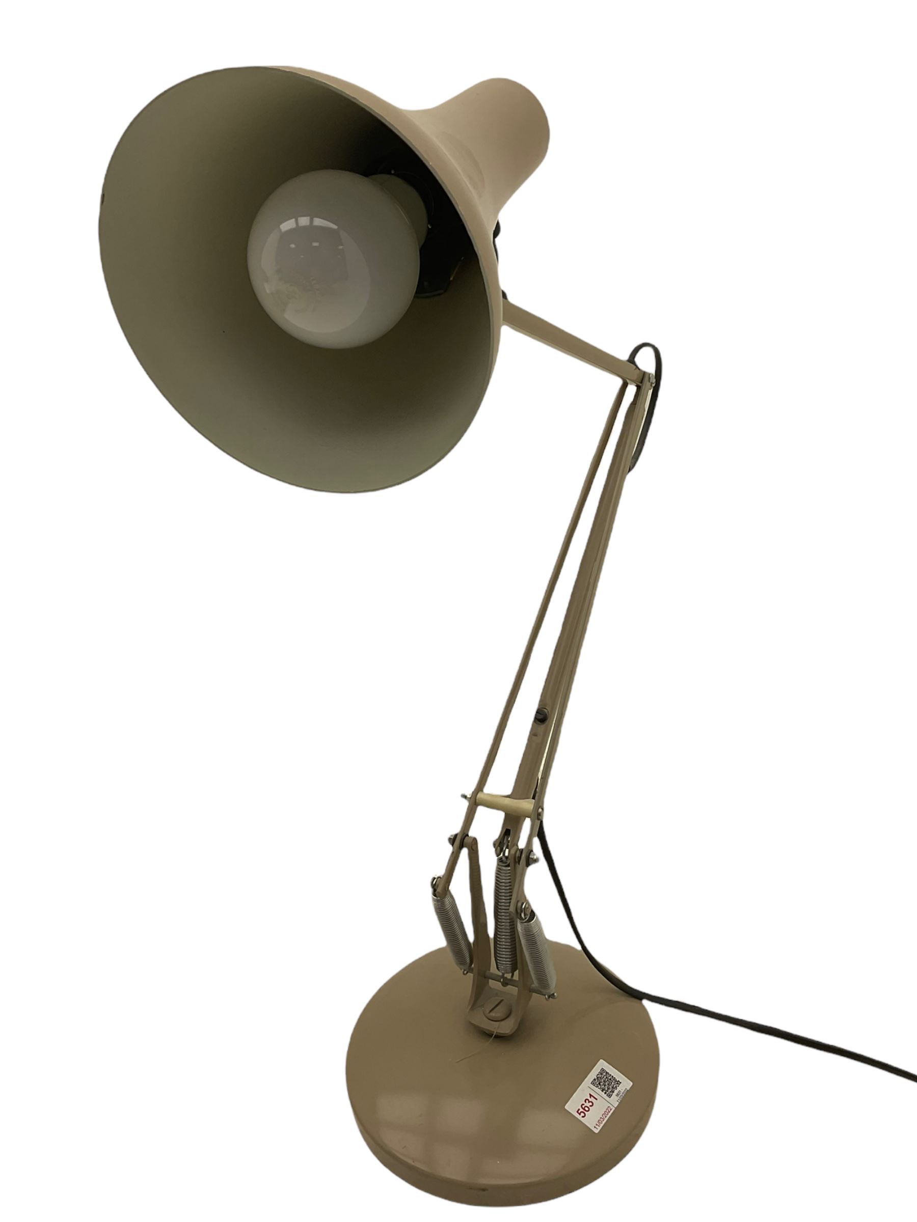 Angle-poise lamp and an Islamic prayer mat