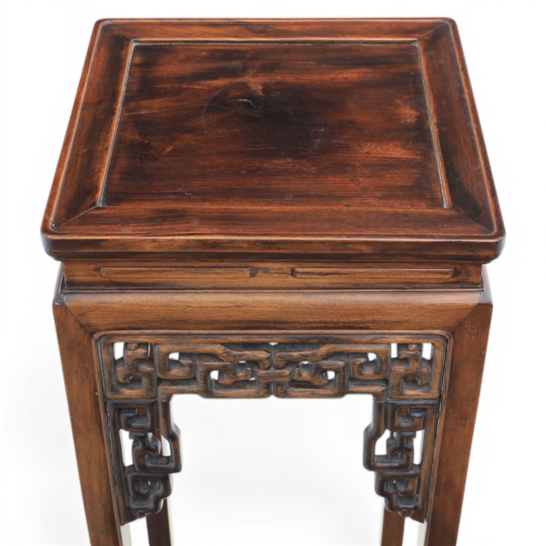 Chinese style hardwood open latticework plantstand, square top ove latticework spandrels raised on square supports united by stretchers