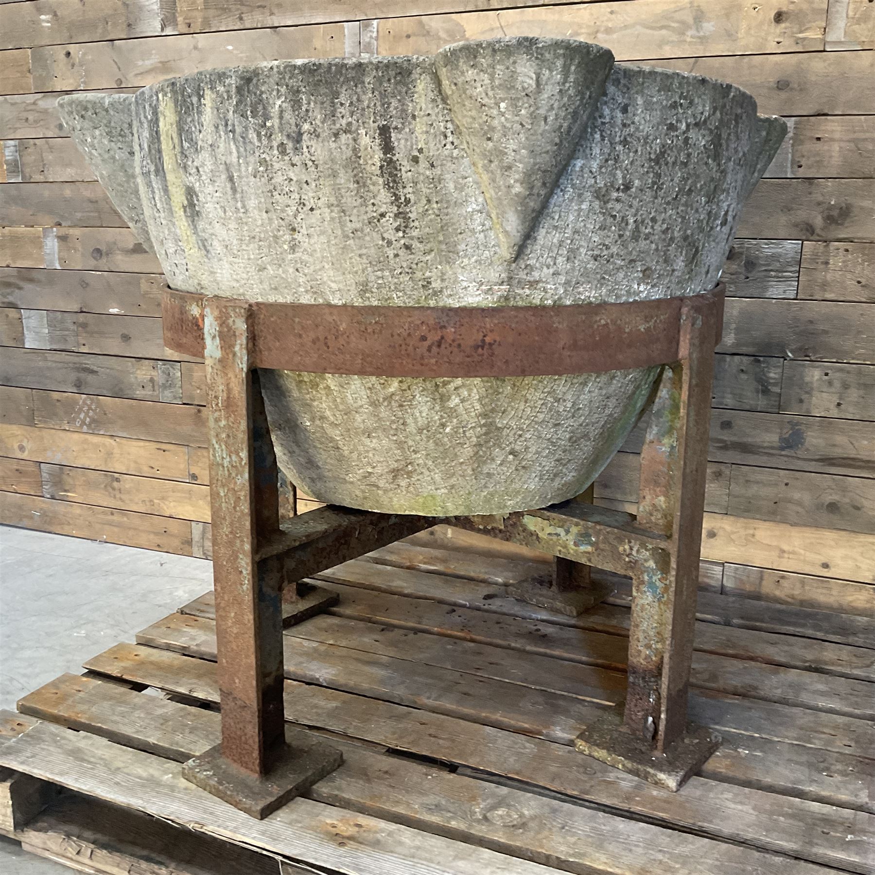 Large 19th century circular stone mortar planter on wrought iron stand