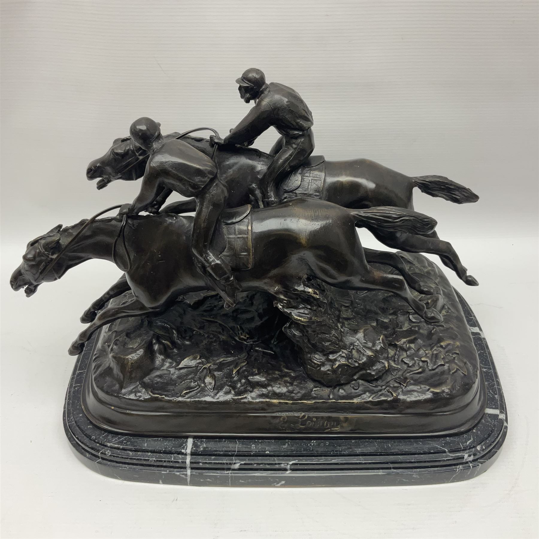 After E Loiscay, bronzed figure group, modelled as two race horses, signed E Loiscay, upon a stepped marble plinth, overall H28cm