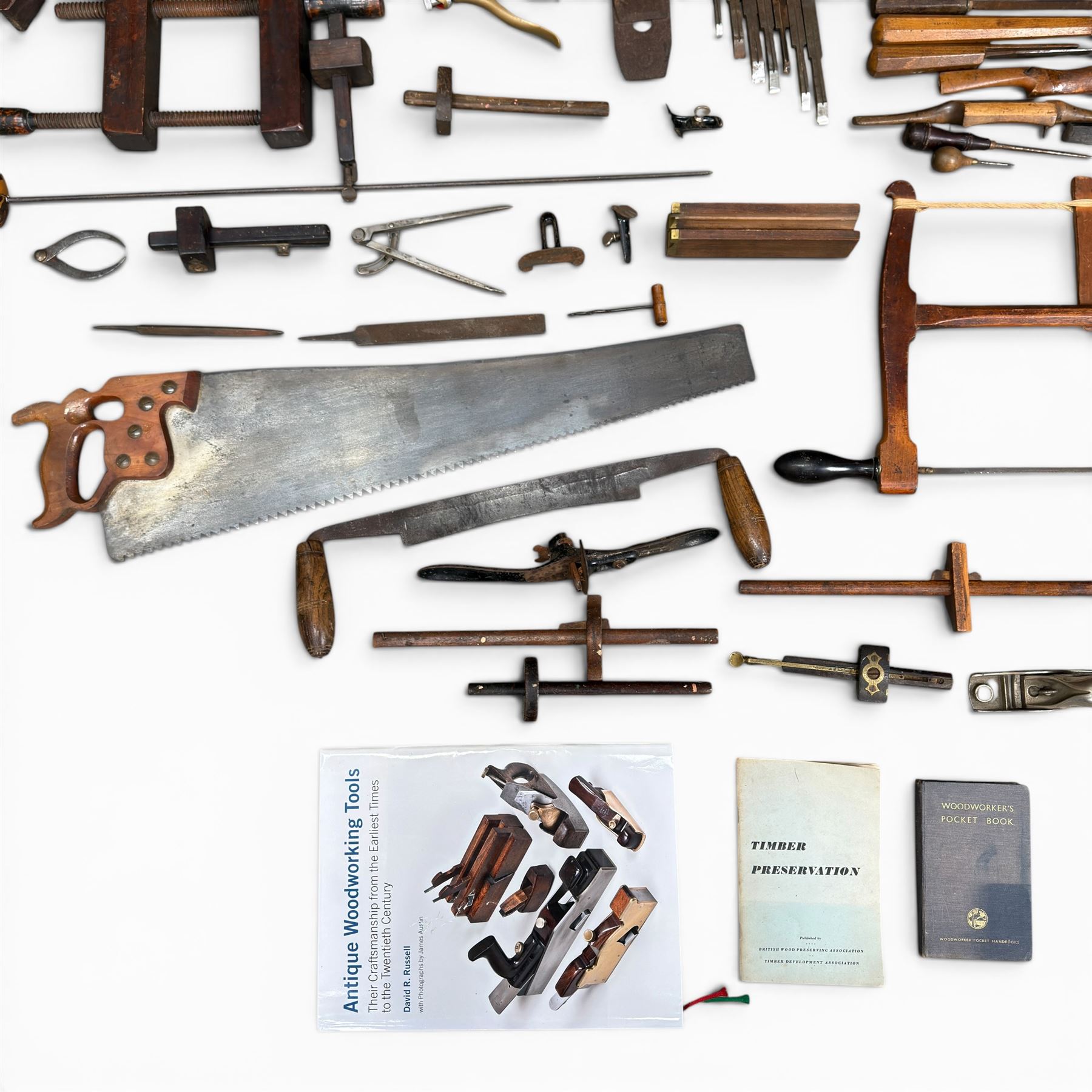 Collection of planes and woodworking tools including wood planes, chisels, hammers etc along with three books (Antique Woodworking Tools, Timber Preservation and Woodworkers Pocket Book)