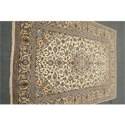  Persian Kashan ivory ground rug, blue floral design with repeating border, 349cm x 246cm  