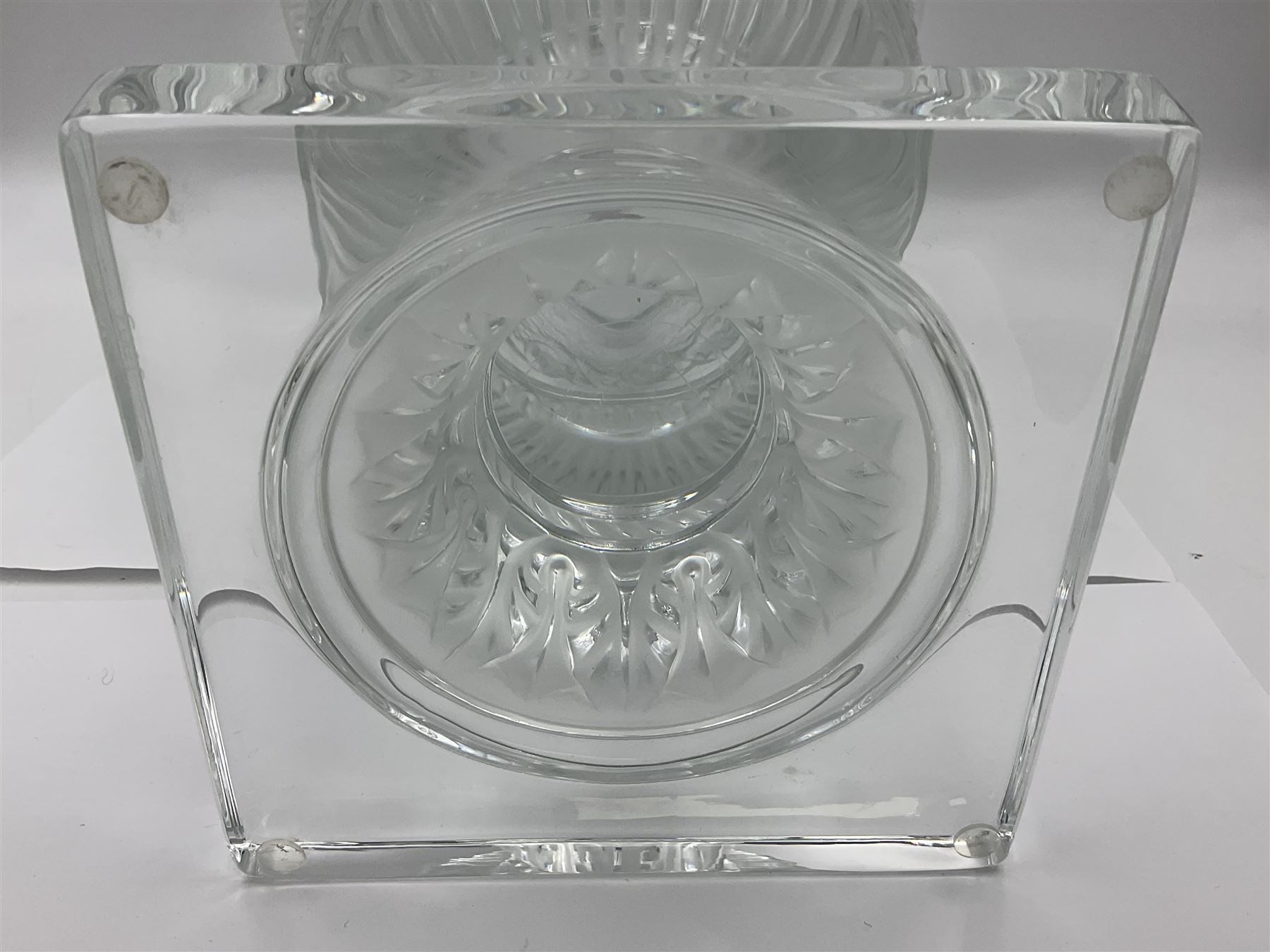 Large and impressive Lalique Versailles pattern glass vase, of classical baluster form with gadrooned flared rim, the body moulded in relief with fruiting vines above part fluting, upon a spreading circular foot with moulded decoration, and plain square plinth base, signed Lalique France to side of plinth, overall H35cm, with original box 