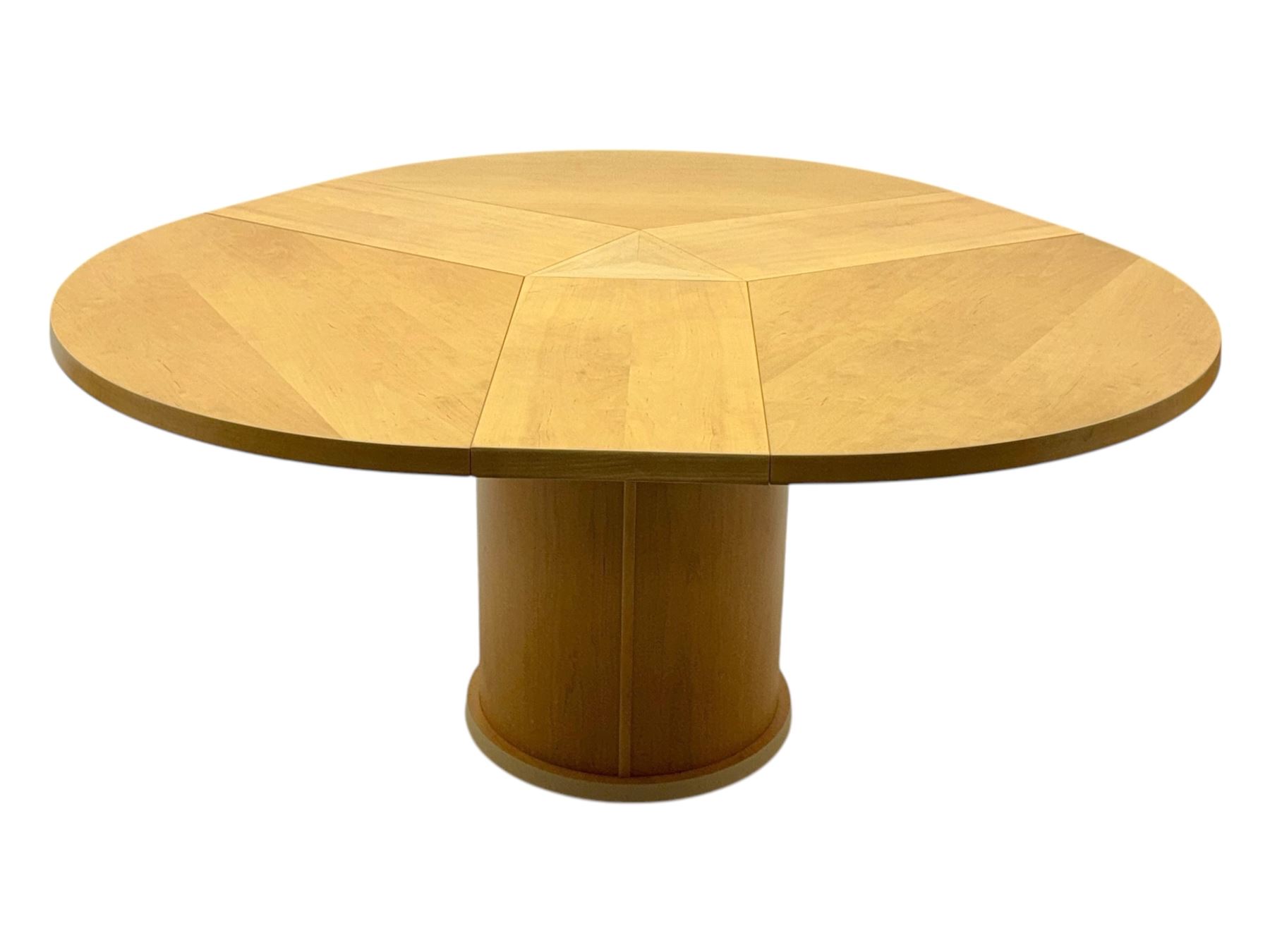 Skovby - 'SM32' late 20th century beech circular extending dining table circular segmented top turning to activate a patented spring loaded triple leaf extension stored within the cylindrical column base (Extended diameter 146cm); and set of four chairs (Width 47cm, Depth 56cm, Height 95cm, Seat height 47cm)