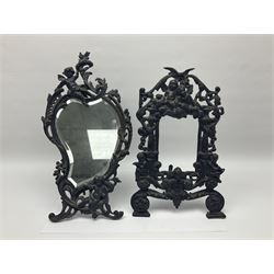 French ornate patinated cast iron picture frame, cast with two central columns, cherubs playing musical instruments and seated winged cherubs within a pierced surround with bird surmount, scroll feet with easel support, inscribed verso 'A.Dyrenne Paris 1882', together with a French Art Nouveau style bronze effect cast iron mirror with bevelled glass plate, stamped Paul Lecourtier, Paris 1878 (2), mirror H41cm, frame H36cm