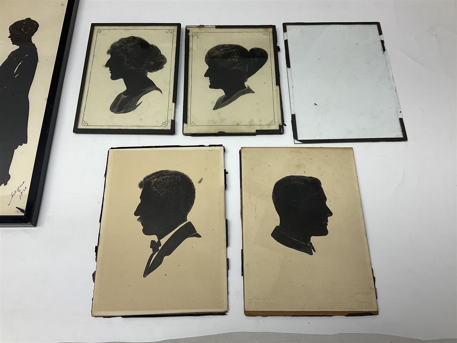 Three early 20th century full profile framed silhouettes, each signed Scot-Ford 1929, together with four hand painted portrait silhouettes and two framed crystoleums, depicting figural scenes (9), largest H35cm