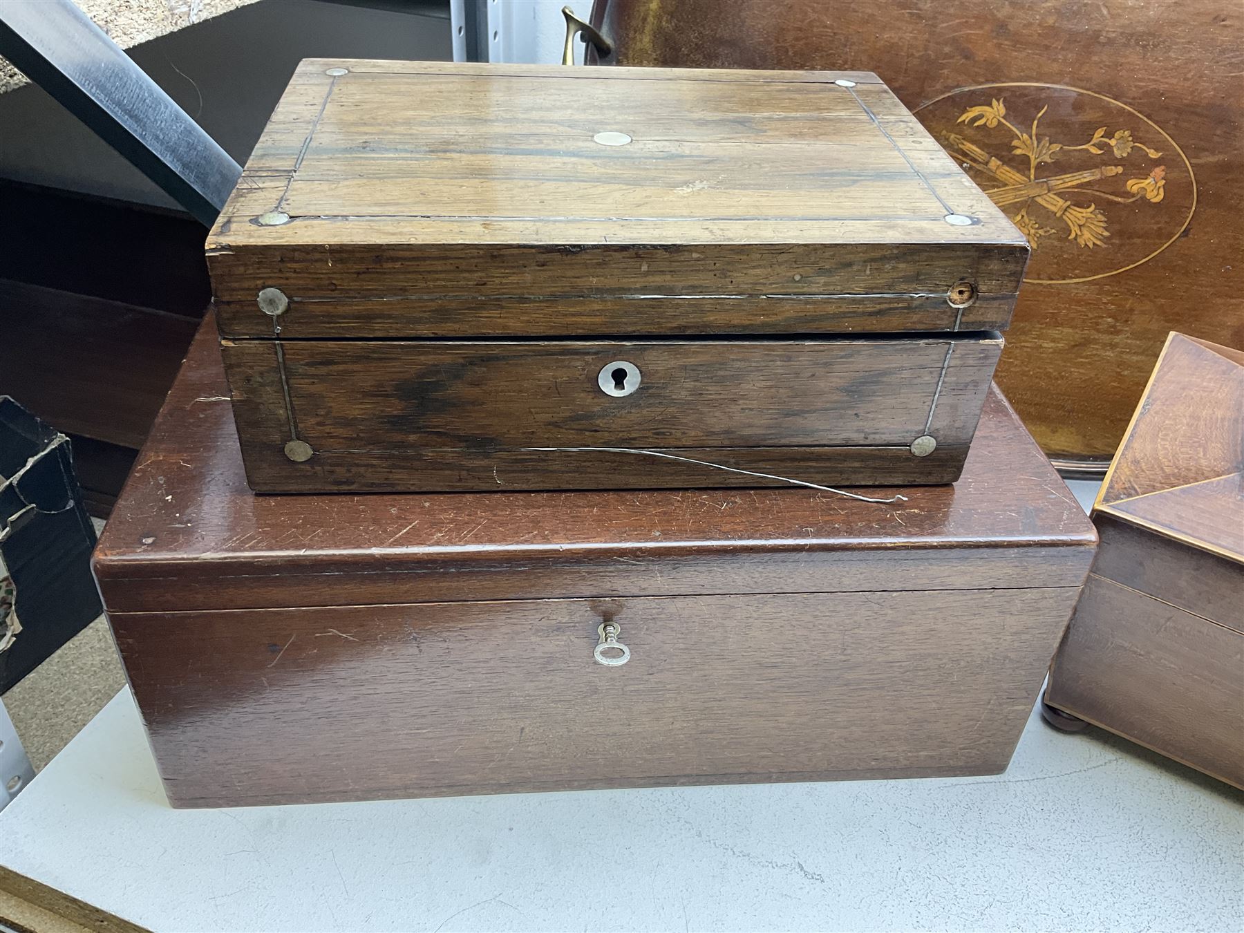 Three 19th century wooden boxes, to include a sewing box of sarcophagus form upon compressed bun feet, plus a mahogany twin handled kidney shaped tray, in one box