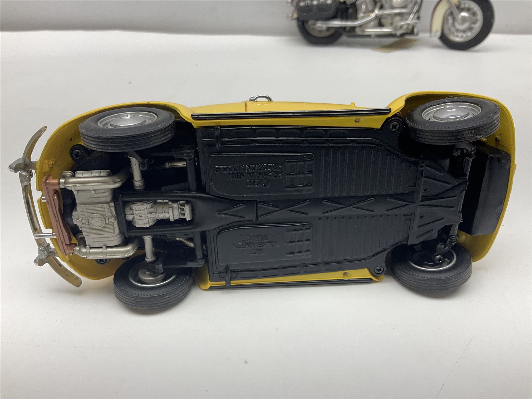 Franklin Mint - three die-cast models comprising 1:10 scale Harley Davidson Heritage Softail motorcycle, 1:24 scale 1957 VW Beetle and 1:24 scale 1993 Rolls Royce Corniche IV; all unboxed (3)