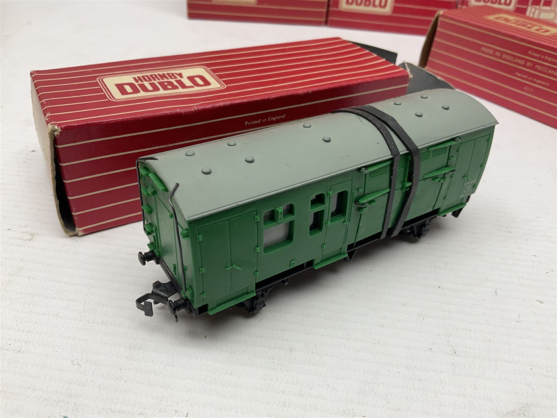 Hornby Dublo - sixteen goods wagons comprising 4644 21-Ton Hopper Wagon, 4315 Horse Box (BR) with horse, 4316 Horse Box (SR) with horse, 4649 Low Sided Wagon with tractor, 4301, 4310, 4311, 4312, 4313, 4320, 4626, 4648, 4652, 4675, 4678 and B550200 (Mineral Wagon); all in red boxes (16)