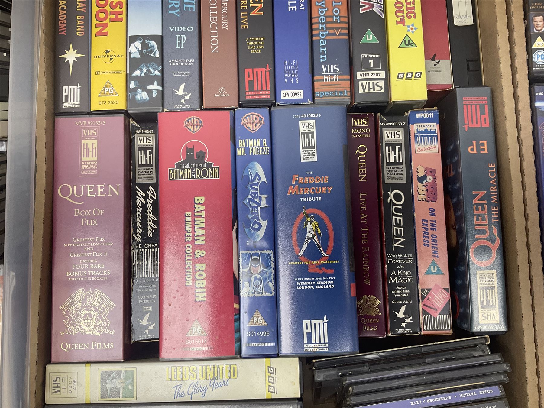 Large collection of VHS tapes, DVDS, CDs to include Queen, James Bond 007, Batman etc, in three boxes
