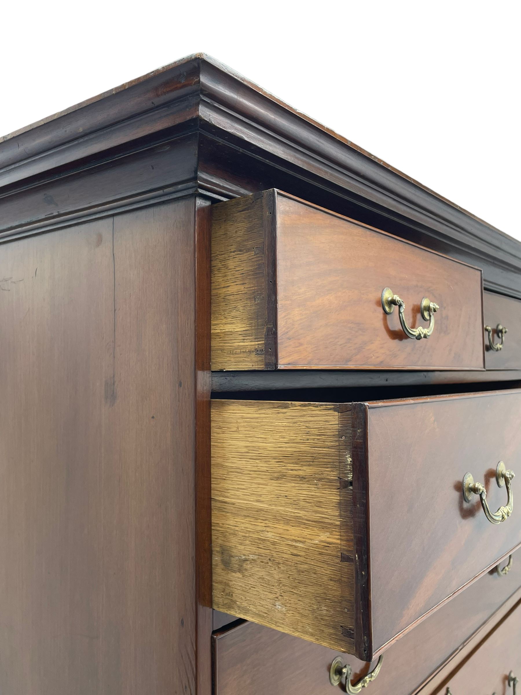 George III figured mahogany chest-on-chest, projecting moulded cornice over two short and six long graduating cock-beaded drawers, on bracket feet