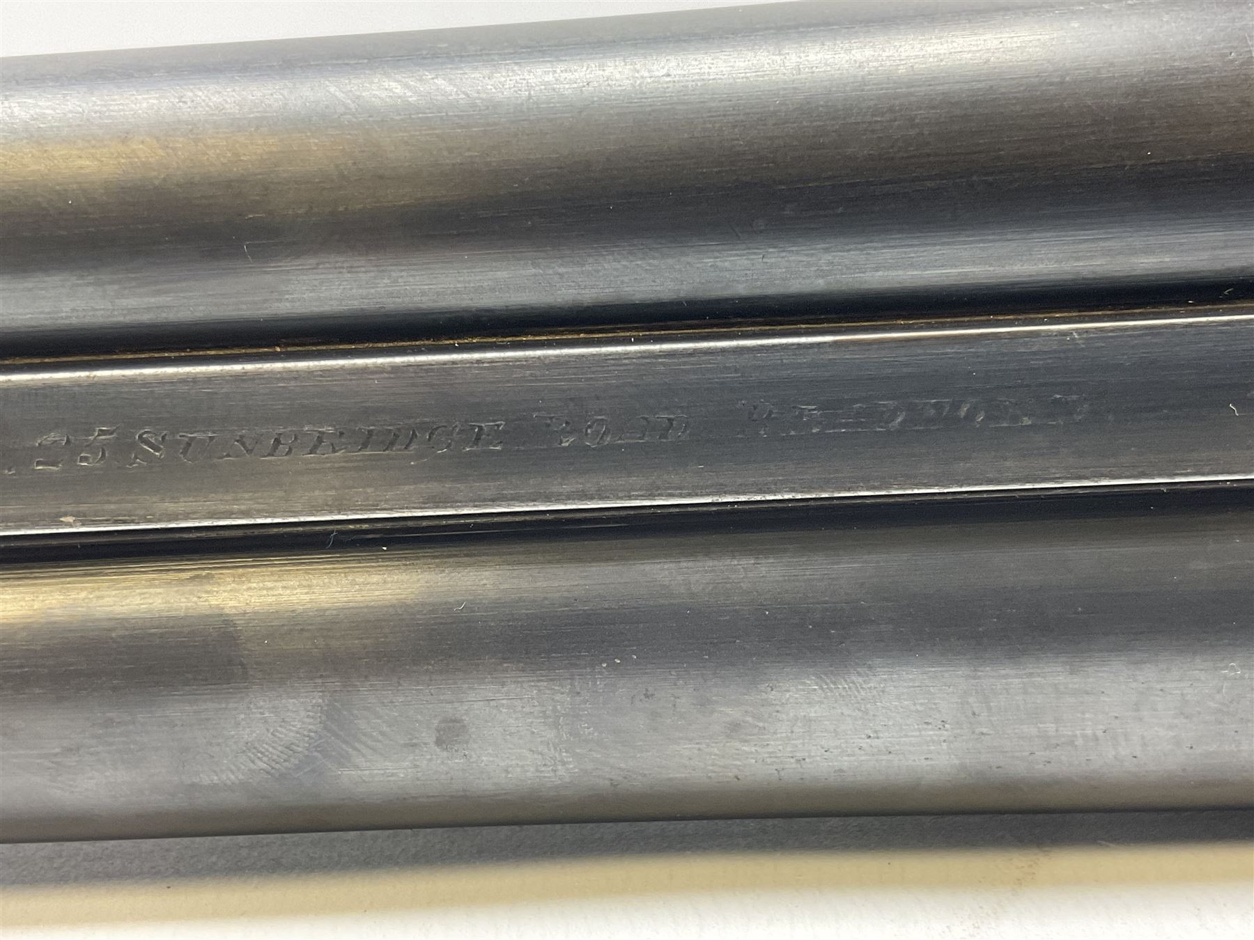 Smith Midgley Bradford 12-bore side-by-side double barrel side-lock ejector shotgun with 71cm barrels, engraved action with patented top lever, ivy leaf fences and top safety, walnut stock with chequered grip and fore-end, serial no.62409 to barrels and 1481 to action, L115cm overall SHOTGUN CERTIFICATE REQUIRED