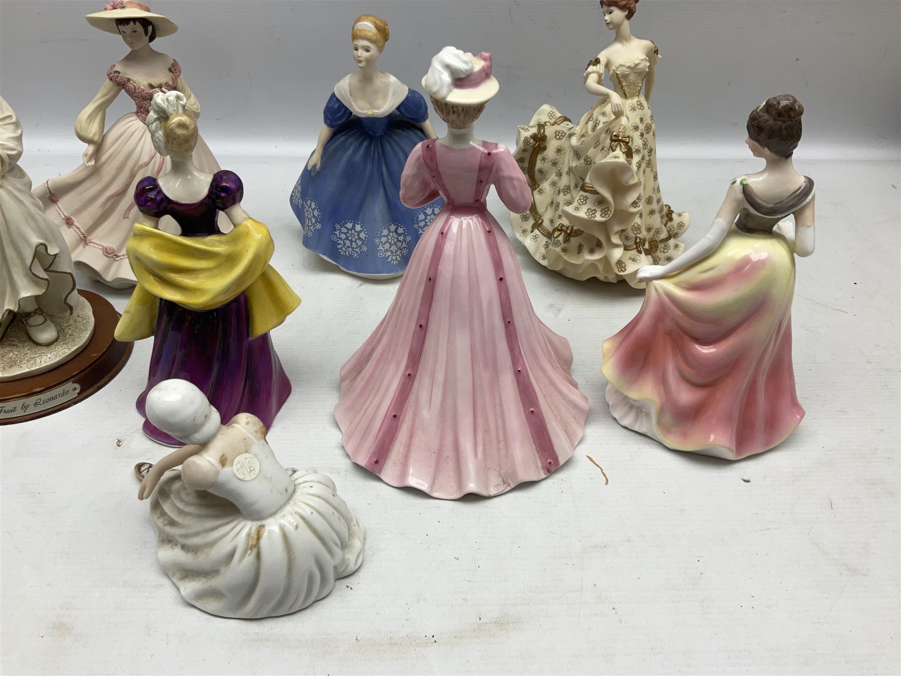 Collection of eight figures comprising Royal Doulton Loretta HN 2337 and Nina HN 2347, Coalport limited edition Emily 740/5000, Danbury Mint Jean, SBL Regal House Collection and three The Leonardo Collection examples