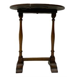 Small early 20th century Georgian style oak table, oval drop leaf top, twin turned pillar supports on stepped sledge feet, joined by stretcher