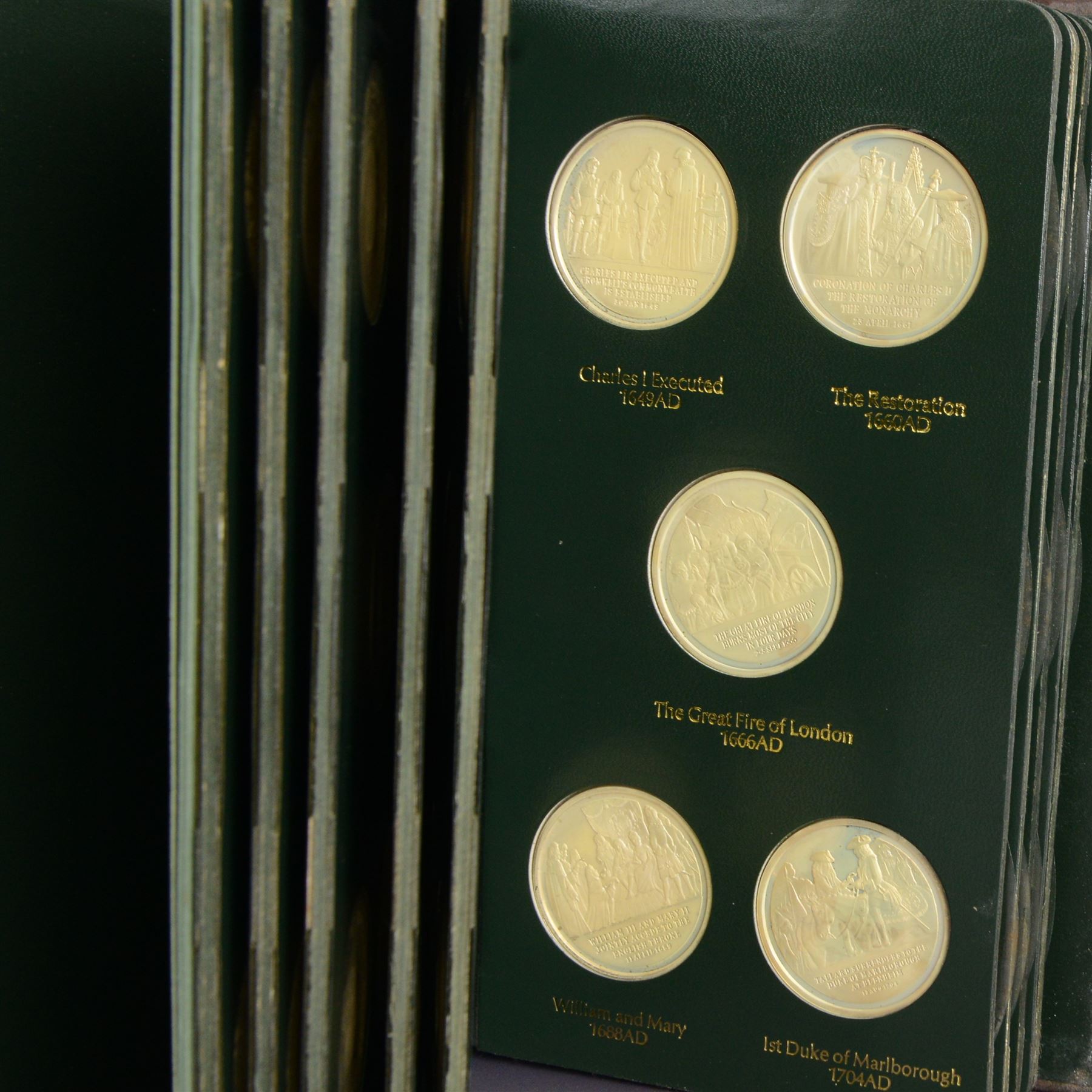 Limited Edition Danbury Mint 'History of the English Speaking Peoples' complete set of fifty silver medallions, each depicting historical figures and scenes from Julius Caesar Lands 55BC to Second World War 1939AD, contained within leatherette folder with personalised presentation to cover and interior, no. 2780/7500