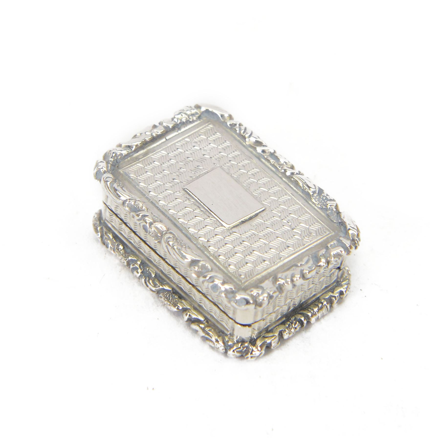 Georgian silver vinaigrette, of typical rectangular form, with engraved decoration and blank cartouche to hinged cover, opening to reveal gilt interior, with personal engraving, hallmarked Ledsam, Vale & Wheeler