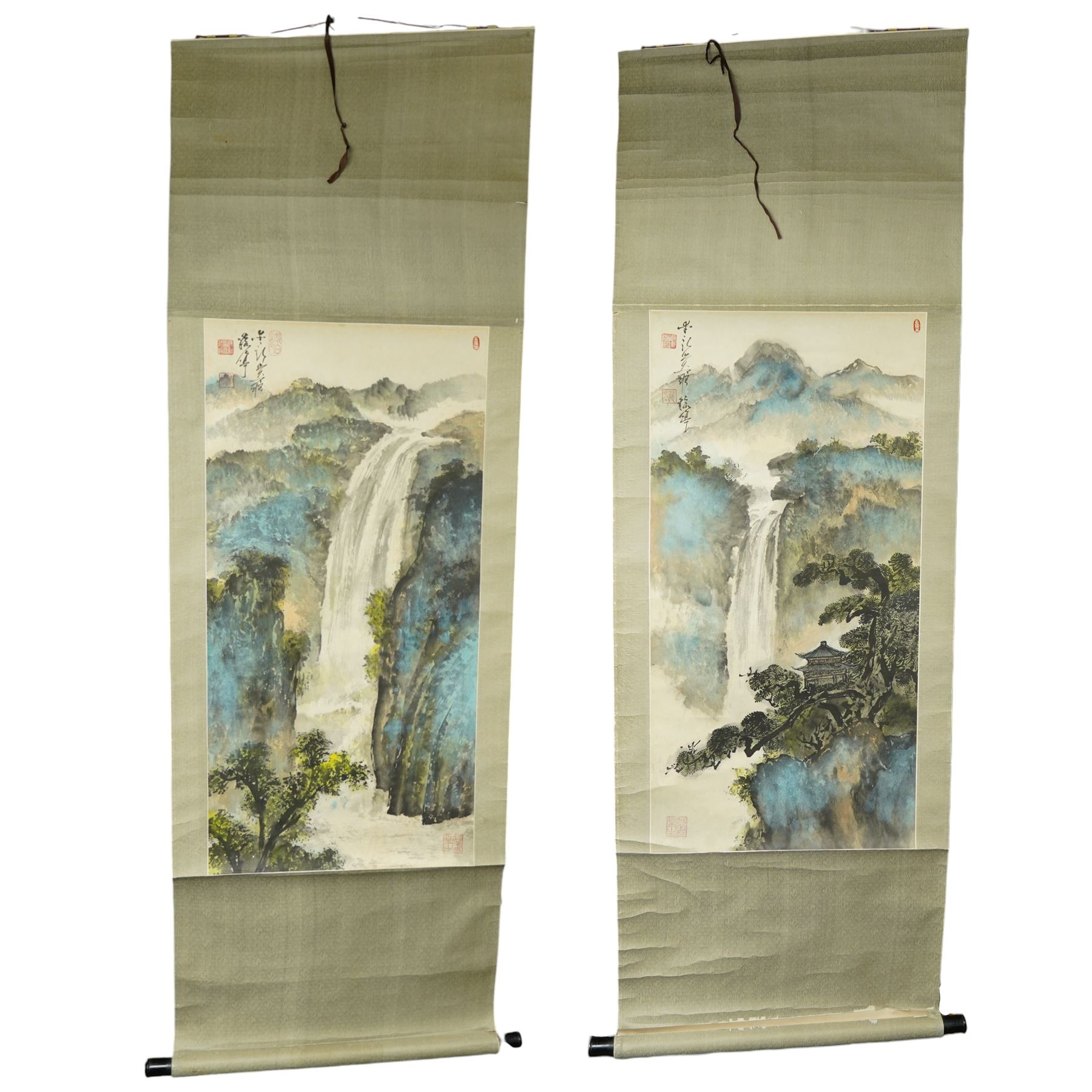 Circle of Aixinjueluo Yuting (Chinese 1952-): Waterfall Landscape and Mountainous Waterfall Landscape with Pagoda, pair watercolours on scroll backing indistinctly signed with artist's seals 89cm x 44cm (2)