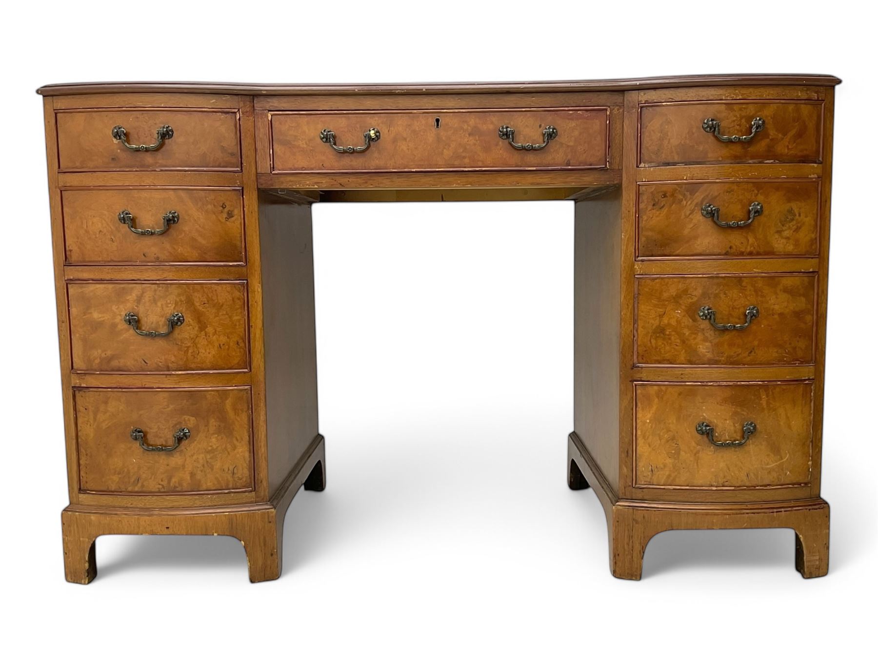 Queen Anne design burr walnut pedestal desk, of serpentine form with green tooled leather inset top, nine drawers with brass swan-neck handles, raised on bracket feet, in three parts