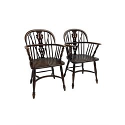 Pair late 20th century oak Windsor elbow chairs, double hoop and stick back with pierced and fretwork work splat, dished seat on turned supports joined by crinoline stretcher