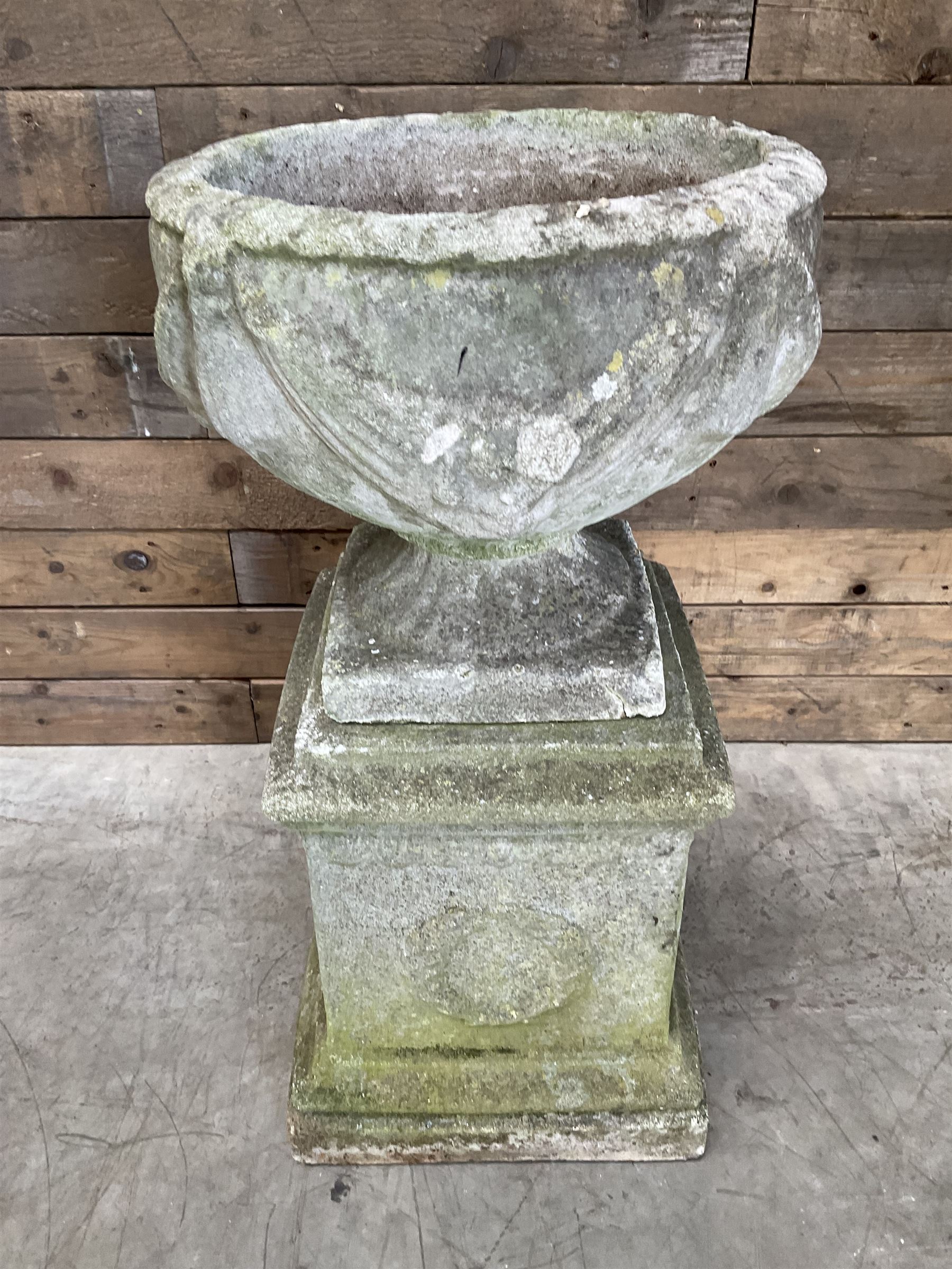 Cast stone centerpiece urn on plinth