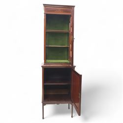 Edwardian inlaid mahogany display cabinet, the moulded cornice above an astragal glazed door enclosing two baize lined shelves, the lower section with a panelled cupboard door, raised on square tapering supports