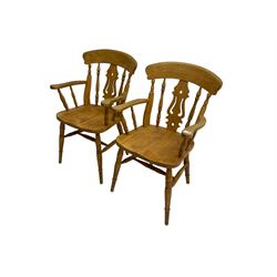 Pair beech farmhouse style elbow chairs, bar back over pierced fiddle splat and turned spindles, on turned supports joined by stretchers