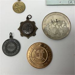 RMS Lusitania iron medallion dated 5th May, 5.5cm diameter, boxed with St Dunstan's Blinded Soldiers Profit paperwork; another unboxed similar Lusitania medallion; 30th Corps Alamein Cuxhaven medallion; Battle of Jutland 1916 silver memorial pendant; Navajo Code Talkers medallion 2000; and five other military related medallions