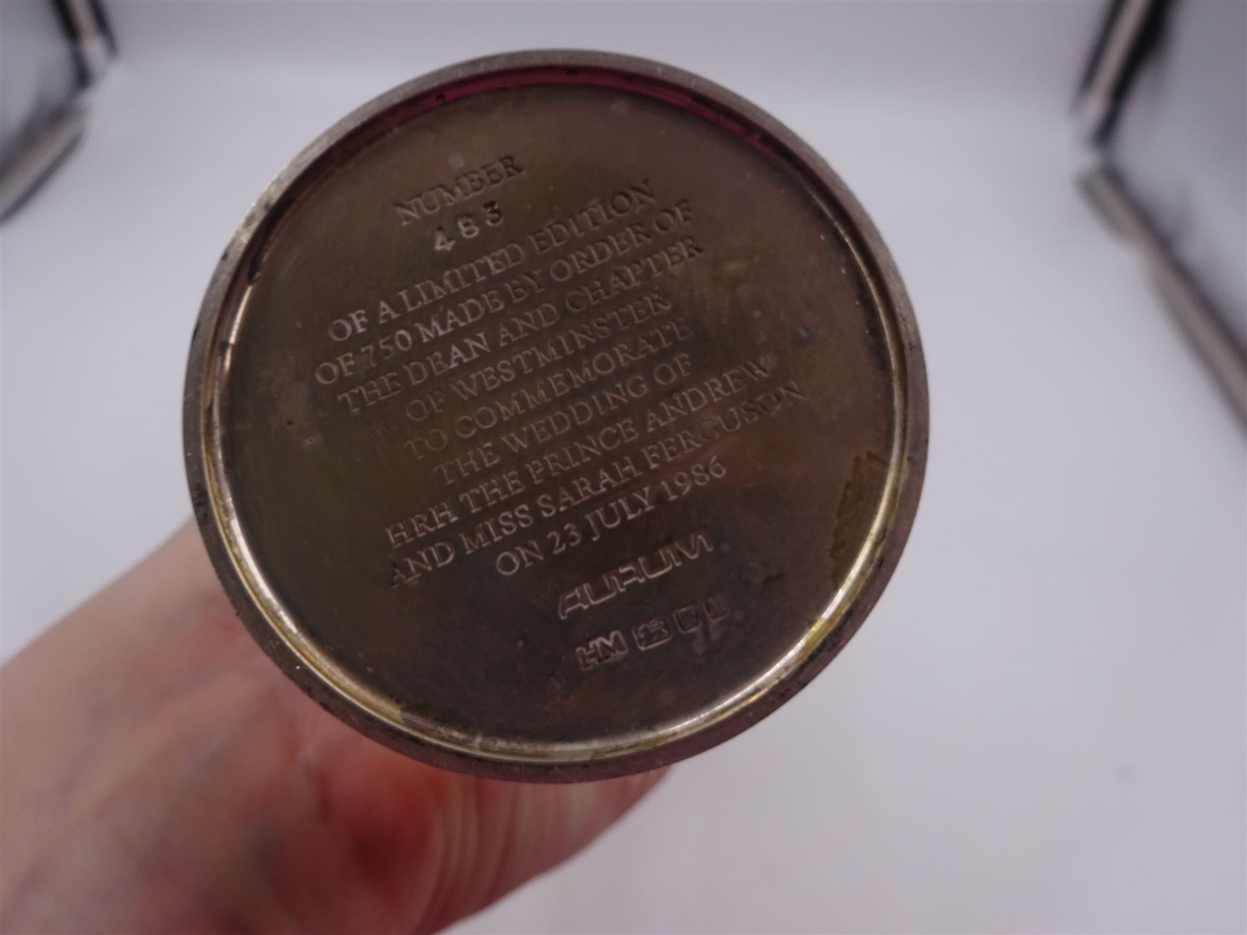 Modern limited edition silver Westminster Abbey Royal Wedding goblet, commemorating the marriage of HRH Prince Andrew and Miss Sarah Ferguson on the 23rd of July 1986, designed by Hector Miller for Aurum, the tapering cylindrical bowl with gilt interior and parcel gilt pierced band to base depicting the Royal Arms, upon knopped stem and circular stepped foot with floral parcel gilt rim, no. 483/750,  hallmarked Hector Miller, London 1986, H17cm