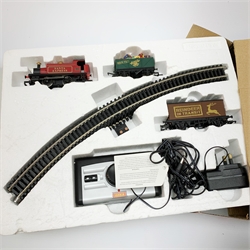 Hornby '00' gauge - Santa's Express set with 0-4-0 tank locomotive No.012, reindeer and present wagons; and Caledonian Local set with 0-4-0 tank locomotive No.1203 and three coaches, both boxed, one with Trakmat (2)