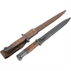  British 1903 pattern SMLE bayonet by Wilkinson London, marked 1903 Wilkinson London to the blade, in scabbard, with leather frog, together with German K98 bayonet with metal scabbard 