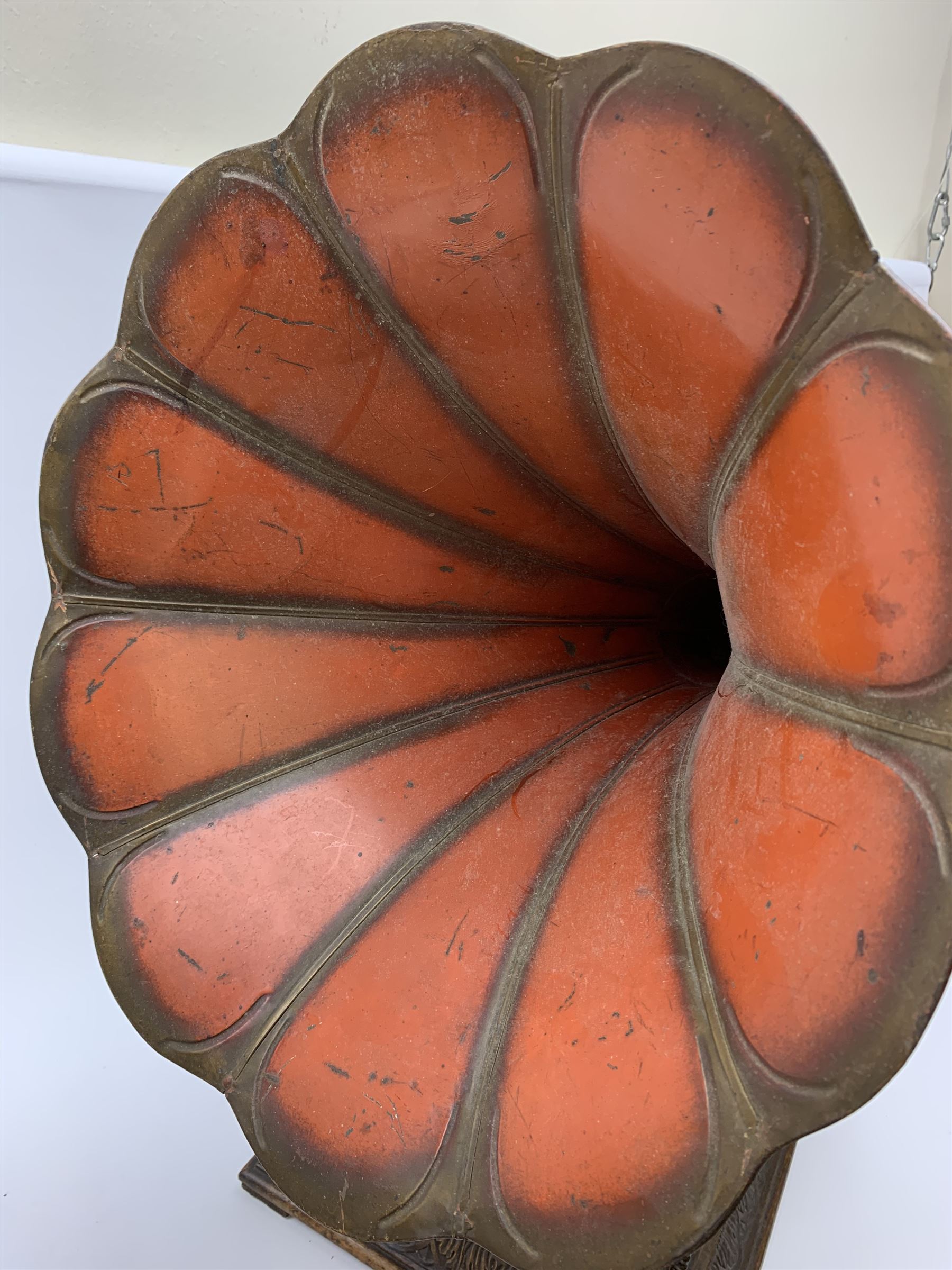 A wind up gramophone with red painted tin plate horn, upon a mahogany base, overall H71cm.