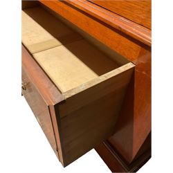 Late Victorian walnut wardrobe, carved arched pediment, fitted with single bevelled mirror door, flanked by carved and figured panels, enclosing hanging rail and hooks, single drawer fitted to base