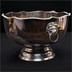 Silver plated four branch centrepiece set with glass bowls and a larger centre bowl and with interchangeable candle sconces H37cm  and a plated punch bowl with lion mask handles D37cm (2)