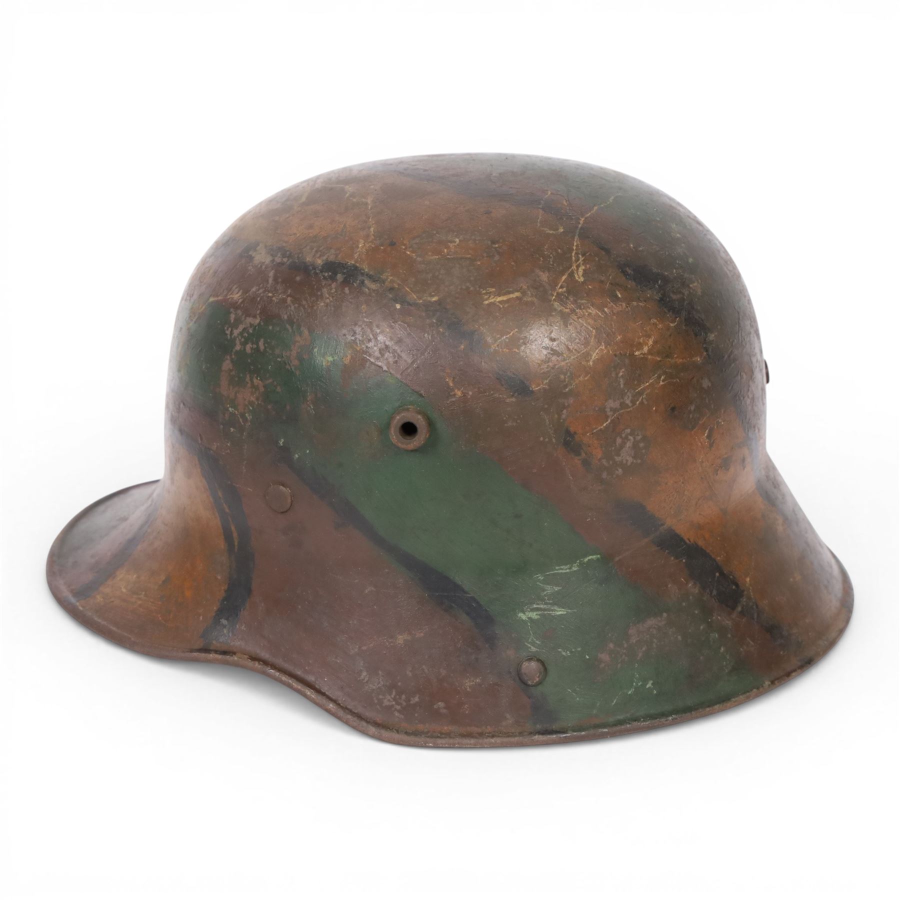 WWI German camouflage M16 helmet, with camouflage painted finish to the skull in green, brown and ochre colours with black separation lines