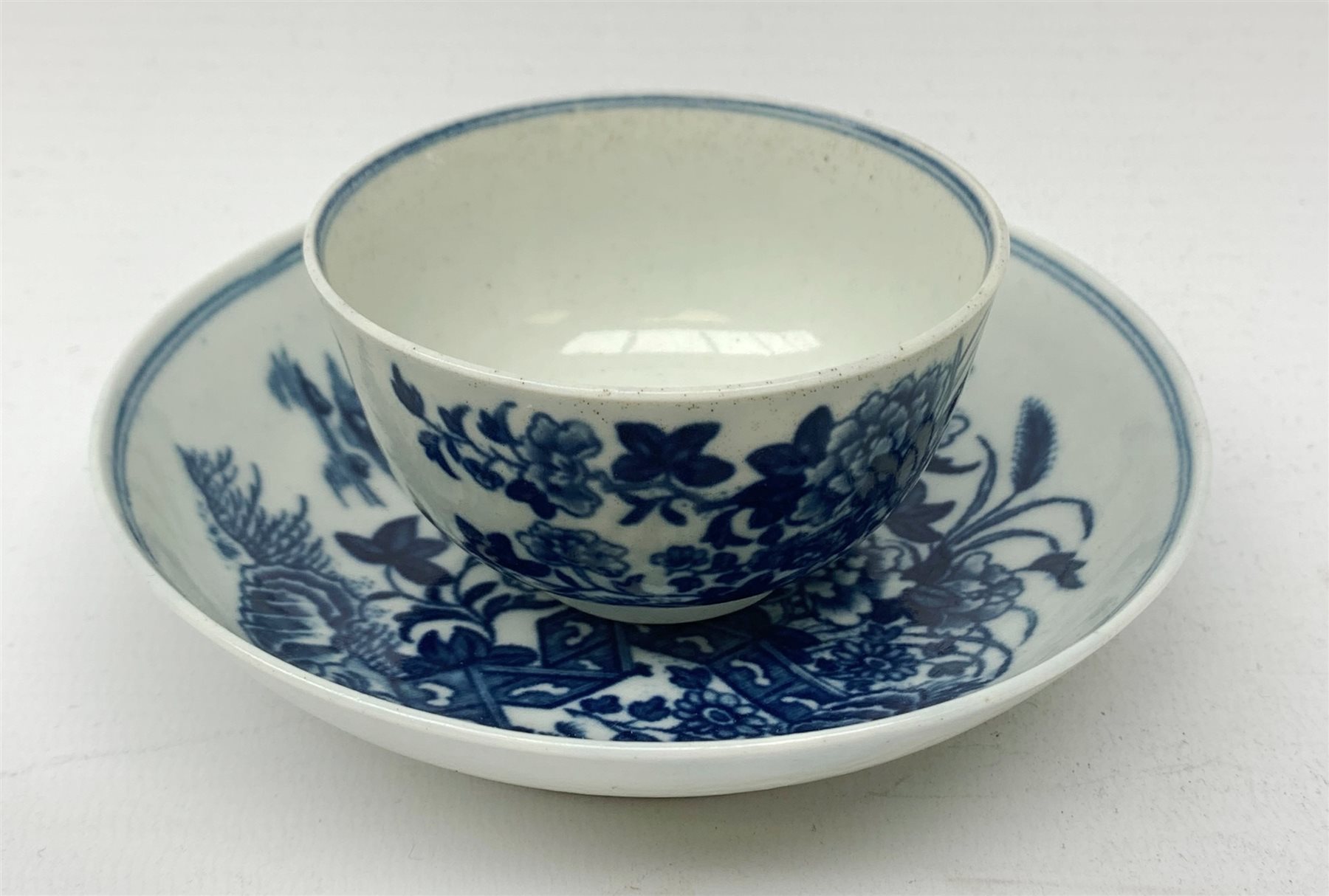 An 18th century Worcester porcelain half size tea bowl and saucer 