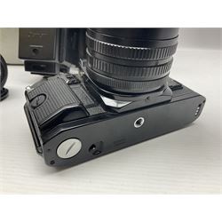 Canon A1 35mm camera body serial no 741264, with 'Tokina AT-X 28-85mm 1:3.5-4.5' lens serial no 821679, 'Canon FD 50mm 1:1.8mm' lens and other camera equipment 