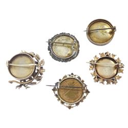 Five 19th century silver portrait brooches, two set with portraits of cherubs and three with women on ivory, three within pierced foliate surrounds. This lot has been registered for sale under Section 10 of the APHA Ivory Act